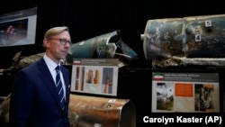 Brian Hook, U.S. special representative for Iran, walks past fragments of Iranian short-range ballistic missiles at a base in Washington, D.C., on November 29.