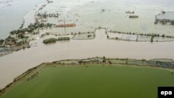 Një territor i vërshuar pas një cikloni që e kishte goditur një pjesë të Indisë në vitin 2009