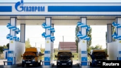 Russia -- Vehicles are seen at a gas filling station, owned by Gazprom Transgaz Stavropol, with the company logo of Russian natural gas producer Gazprom seen on the station, in Stavropol, October 9, 2013