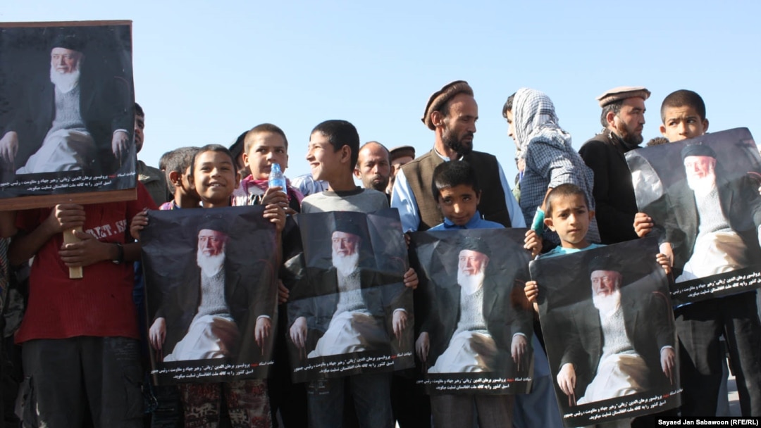Afghans hold portraits of former Afghan President Burhanuddin Rabbani at an antigovernment demonstration in Kabul last week.