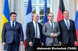 (Left to right) Ukrainian Foreign Miniser Pavlo Klimkin (left), French Foreign Minister Jean-Yves Le Drian, German Foreign Minister Heiko Maas, and Russian Foreign Minister Sergei Lavrov in Berlin on June 11