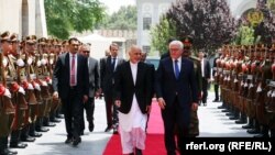 Afghan President Ashraf Ghani (right) welcomes German counterpart Frank-Walter Steinmeier to the Gulkhana-Palace in Kabul on July 13.