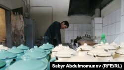 A young man works at an Uzbek cafe in the southern city of Osh.