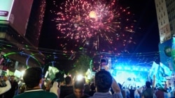 People in Lahore watch fireworks to show solidarity with the Pakistan army on May 11,