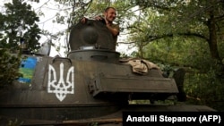 Украинский военный в бронемашине в Харьковской области. ВСУ проводят контрнаступление в нескольких регионах, в том числе под Харьковом.