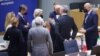 European Commission President Ursula von der Leyen (center) speaks with European Council President Charles Michel (third from right) with other EU leaders during a special meeting of an emergency summit called to discussion Russia's invasion of Ukraine. 