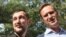 RUSSIA -- Russian opposition leader Aleksei Navalny (R) speaks as he stands next to his younger brother Oleg (L) in the village of Naryshkino, in the Oryol region south of Moscow, June 29, 2018