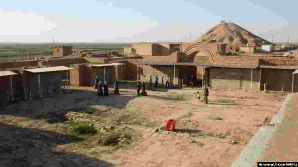 One of the historic sites of Nimrud with an Assyrian ziggurat, or temple, in the background