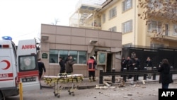 Turkey -- People stand outside the entrance of the US embassy in Ankara, 01Feb2013