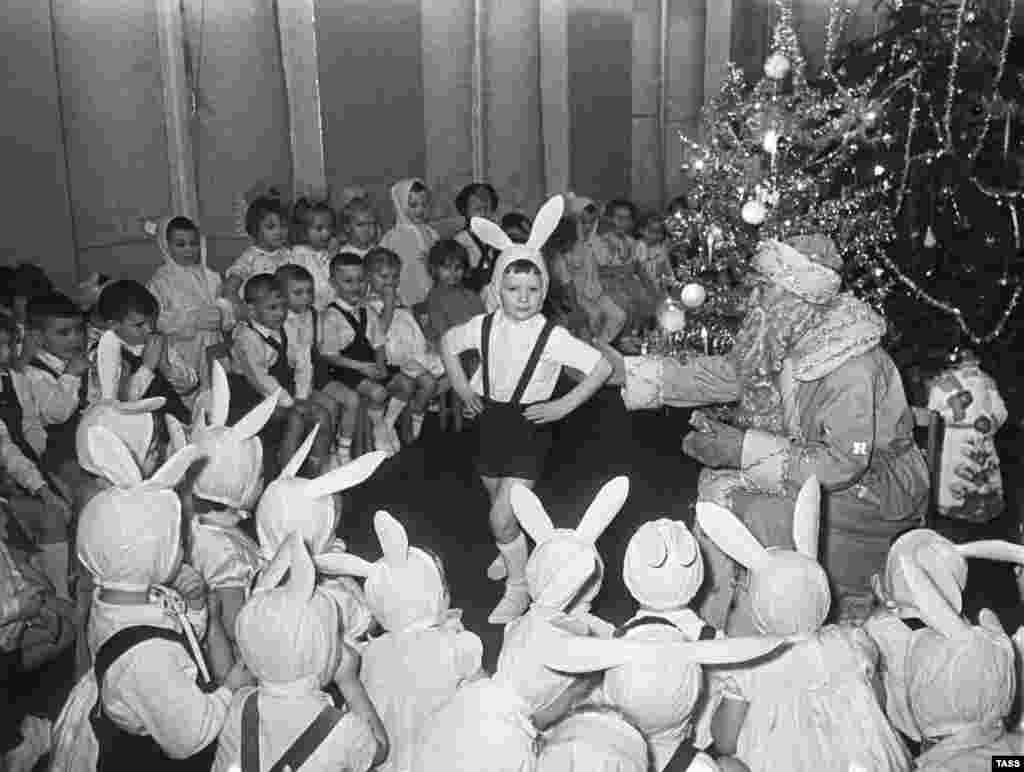 A New Year's celebration in a kindergarten in 1963. While Christmas is the most popular day for gift-giving and merrymaking in most of the Christian world, Russia's biggest such celebration is on December 31, when Xmas traditions meet the champagne-soaked partying of New Year's Eve. 