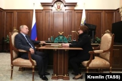 Russian President Vladimir Putin (left) and Russian Central Bank Governor Elvira Nabiullina (file photo)