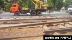 Uzbekistan - workers are demolishing tramline in Tashkent