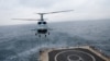 Russia tests a Kamov Ka-29 assault transport helicopter aboard a landing ship in the Baltic Sea near Kaliningrad.