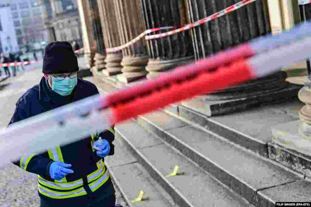 A police officer at the crime scene after the overnight burglary, November 25, 2019.