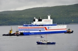 Russia's floating nuclear power plant, the Akademik Lomonosov, leaves the service base of Atomflot for a journey along the Northern Sea Route to Chukotka from Murmansk on August 23.