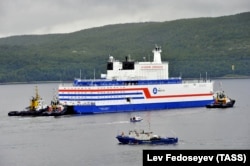 Russia's floating nuclear power plant, the Akademik Lomonosov, leaves the service base of Atomflot for a journey along the Northern Sea Route to Chukotka from Murmansk on August 23.