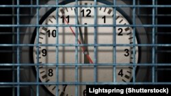 Generic - ©Shutterstock photo. Locked schedule business concept and doing time behind bars with a time clock confined away in prison as a symbol of schedule management and locking in dates for special events during days and weeks, undated