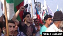 Azerbaijani opposition leader Ali Kerimli's son Turkel attends an opposition rally in Baku on September 22.