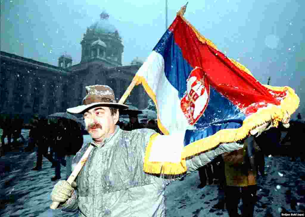 A Serbian protestor demonstrates against President Slobodan Milosevic in front of the parliament building in Belgrade in 1996.