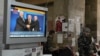 Ukraine -- Pro-Russian fighters of Vostok (East) battalion stands next to a TV during a broadcast of Belarusian President Alyaksandr Lukashenka, Kazakh President Nursultan Nazarbaev and Russian President Vladimir Putin, in the regional state building in t