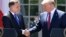U.S. President Donald Trump (right) and Polish President Andrzej Duda shake hands after holding a joint press conference in the Rose Garden of the White House in Washington on June 12.