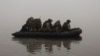 Ukrainian marines are seen on the Dnieper River near Kherson last month.