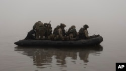 Ukrainian marines are seen on the Dnieper River near Kherson last month.