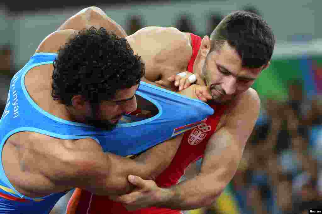 Davor Stefanek of Serbia and Migran Arutyunyan of Armenia compete in the final of the men's Greco-Roman 66-kilogram wrestling. Stefanek took gold.