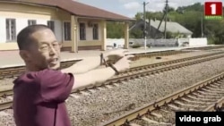 A screen grab from the the Belarus 1 TV channel showing a Japanese man whom security forces say they detained.