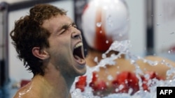 Russia's Denis Tarasov reacts to winning the men's 50-meter freestyle final S8 category during the London 2012 Paralympic Games.