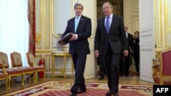 U.S. Secretary of State John Kerry (left) and Russian Foreign Minister Sergei Lavrov at the start of their meeting at the Russian ambassador's residence in Paris on March 30