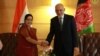 Afghan President Ashraf Ghani (right) shakes hands with External Affairs Minister Sushma Swaraj in New Delhi on October 24.