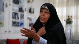 Faezeh Hashemi speaks to an interviewer in Tehran on September 6.