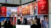 File photo- Visitors browse the exhibition stand of Iran at the International Tourism Trade Fair (ITB) in Berlin, March 9, 2016