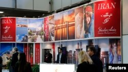 File photo- Visitors browse the exhibition stand of Iran at the International Tourism Trade Fair (ITB) in Berlin, March 9, 2016