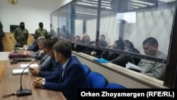 Defendants listen to the verdict in the case in Nur-Sultan on December 11.