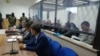 Defendants listen to the verdict in the case in Nur-Sultan on December 11. 