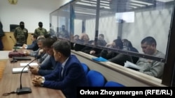 Defendants listen to the verdict in the case in Nur-Sultan on December 11. 