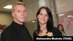 Aleksander Kuznetsov and his wife attend the opening of a film festival in Moscow in 2010.