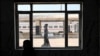 Shi'ite pilgrims wait in the Basra railway station to take the train to the shrine city of Karbala on August 19. 