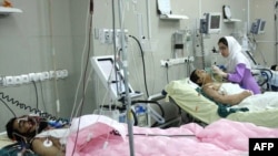 A nurse checks on patients in Zahedan.