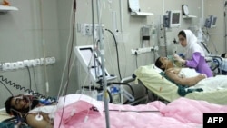 Wounded men in a hospital in Zahedan following the bomb blast in May, which killed 25 people.