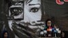 A social worker addresses a gathering of Afghan women at a hall in Kabul on August 2 amid spiking violence by the Taliban.