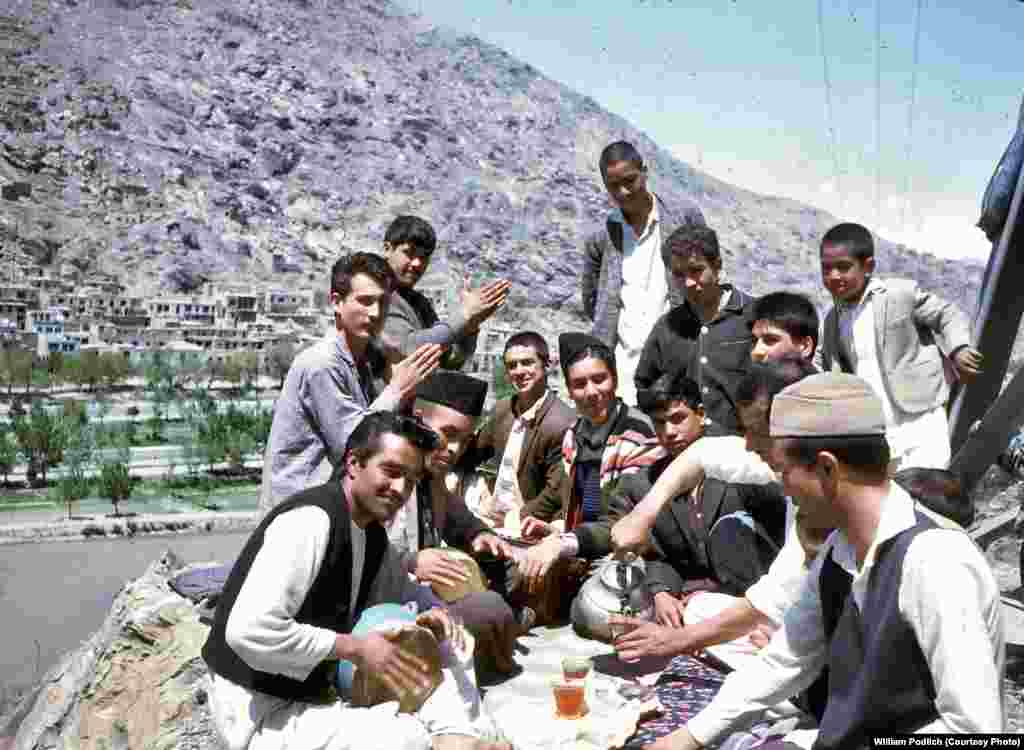 Young Afghans gather to share tea, sing, and play music.