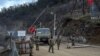 Azerbaijani soldiers patrol at a checkpoint outside the town of Susa. (file photo)