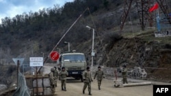 Nagorno-Karabakh - Azerbaijani soldiers patrol at a checkpoint outside the town of Shushi on November 26, 2020.