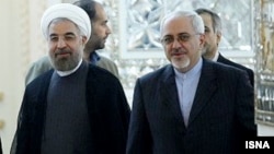 Iranian President Hassan Rohani (left) has handed over responsibility for nuclear negotiations to his foreign minister, Mohammad Javad Zarif (right), perhaps signaling a more flexible approach.