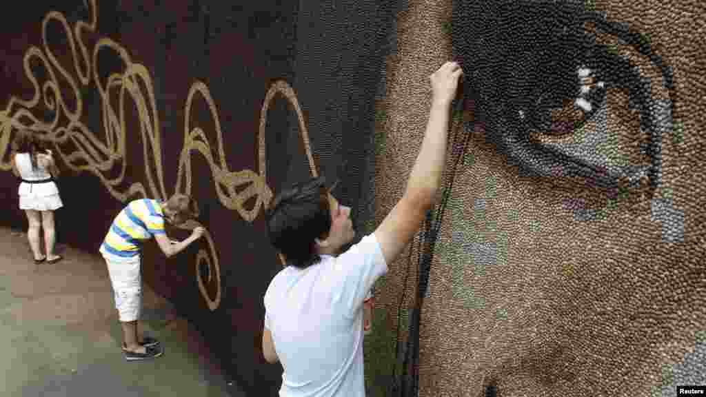 It is also being used as a venue for various creative performances and innovative art installations, such as this mural made completely out of coffee beans. 