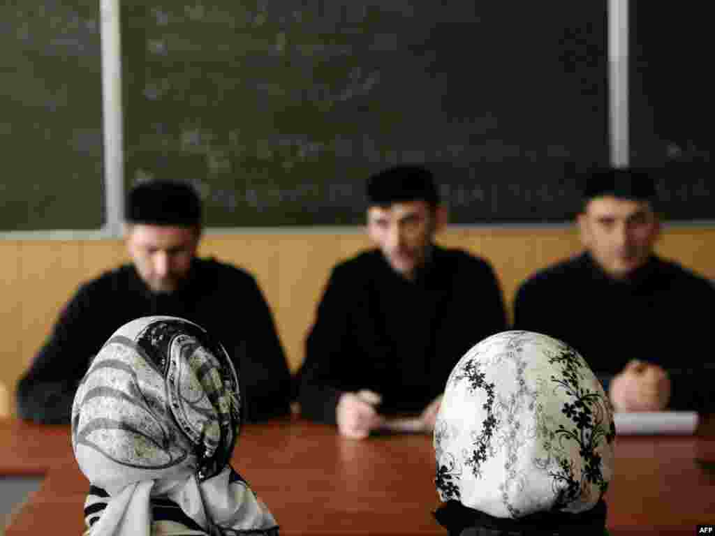 Female students wear head scarves during classes at the Grozny State Oil Institute in Chechnya. The Kremlin-backed Chechen president, Ramzan Kadyrov, issued a decree establishing an Islamic dress code for female public servants. (AFP/Mikhail Mordasov)