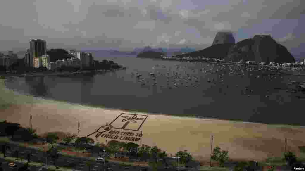 Ahead of the soccer World Cup in Brazil, people form a giant "red card" protesting against child labor at Botafogo beach in Rio de Janeiro on June 11. (Reuters/Pilar Olivares)